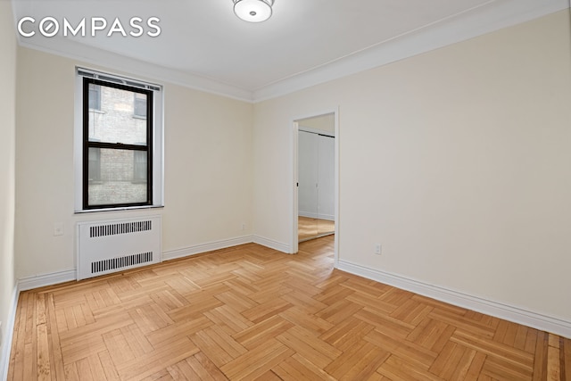 41-09 41st St Unit 2B, New York City, NY 11104 - unfurnished room featuring radiator heating unit and ornamental molding
