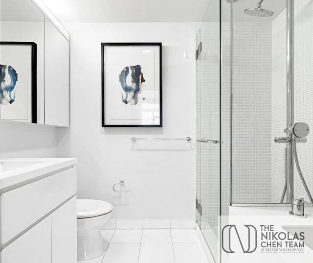 425 W 53rd St Unit 205, New York City, NY 10019 - full bathroom featuring vanity, a shower stall, and tile patterned flooring