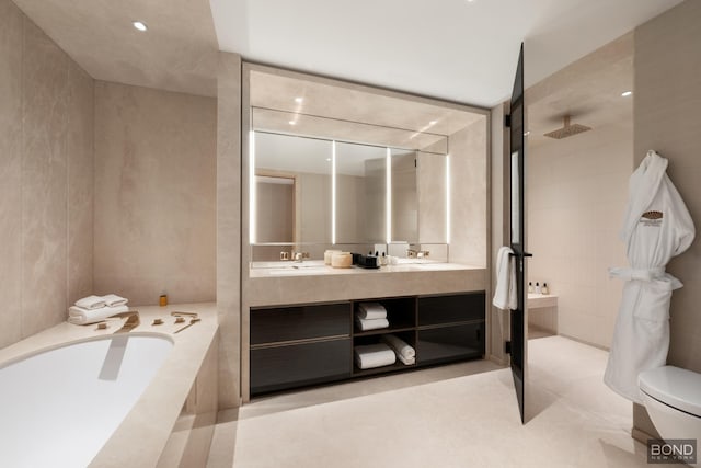 685 5th Ave Unit 9A, New York City, NY 10022 - bathroom with a garden tub, double vanity, and a tile shower