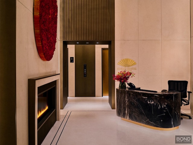 685 5th Ave Unit 9A, New York City, NY 10022 - reception with a glass covered fireplace