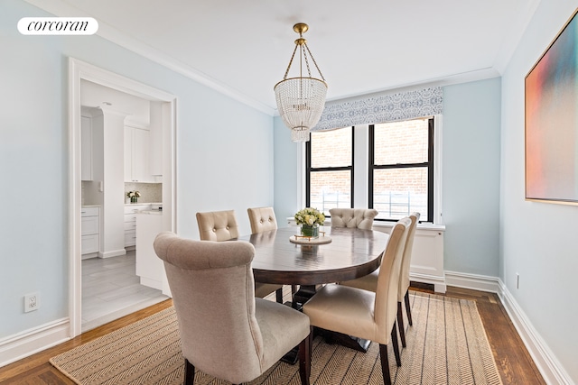 174 W 76th St Unit 3H, New York City, NY 10023 - dining room with a chandelier, wood finished floors, and crown molding