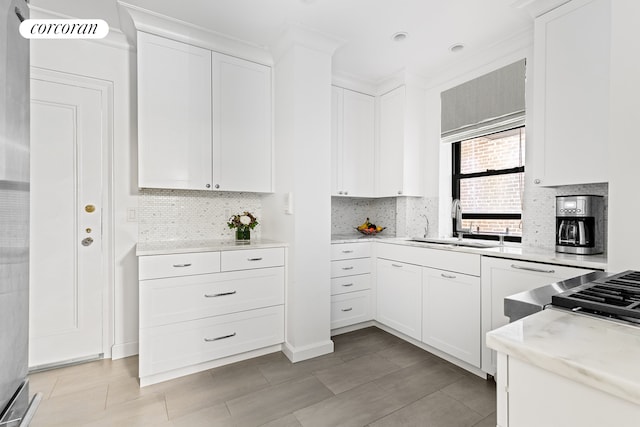 174 W 76th St Unit 3H, New York City, NY 10023 - kitchen with decorative backsplash and white cabinets