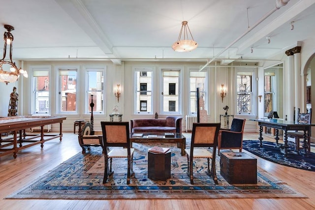 684 Broadway Unit 4E, New York City, NY 10012 - dining room with wood finished floors, beam ceiling, and a chandelier