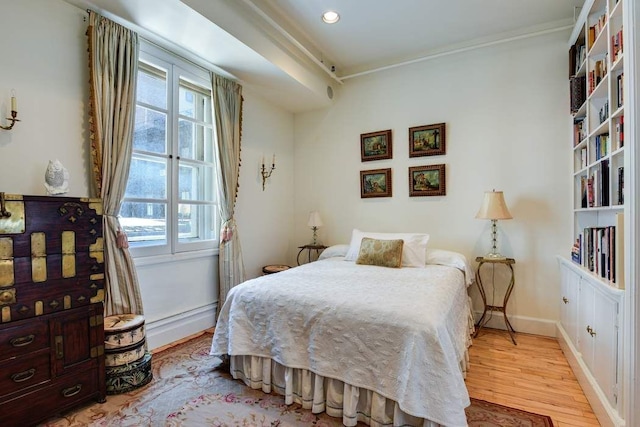 684 Broadway Unit 4E, New York City, NY 10012 - bedroom with light wood-style flooring, ornamental molding, and recessed lighting