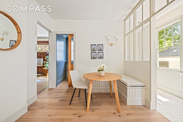 320 E 18th St Unit 5, New York City, NY 11226 - dining room with light wood-type flooring and baseboards