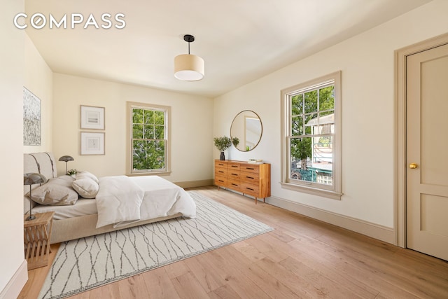 320 E 18th St Unit 5, New York City, NY 11226 - bedroom with light wood-type flooring