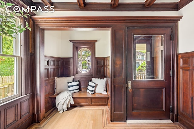 320 E 18th St Unit 5, New York City, NY 11226 - mudroom with a wainscoted wall, beamed ceiling, wood finished floors, and a decorative wall