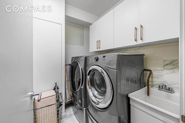 124 E 13th St Unit 3, New York City, NY 10003 - laundry room featuring cabinet space and washer and dryer