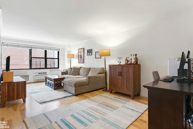 340 E 74th St Unit 9G, New York City, NY 10021 - living room with crown molding, light wood-type flooring, and a desk