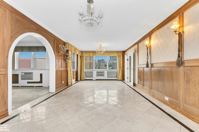 1175 York Ave Unit Phb4, New York City, NY 10065 - unfurnished sunroom featuring a chandelier, arched walkways, and an AC wall unit