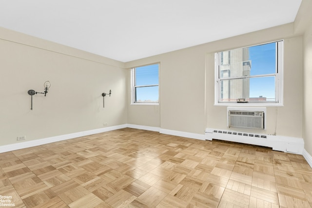 1175 York Ave Unit Phb4, New York City, NY 10065 - spare room with a baseboard radiator and an AC wall unit