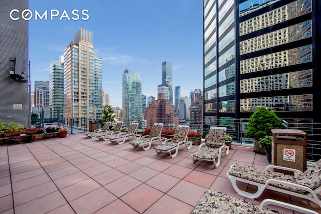 211 E 53rd St Unit 7C, New York City, NY 10022 - view of patio featuring a view of skyline