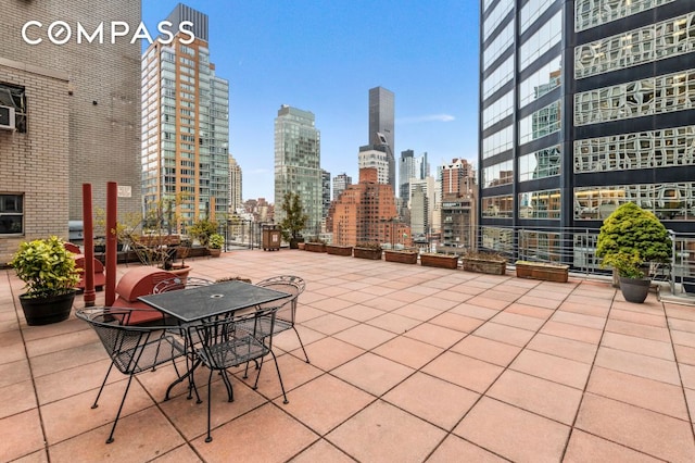 211 E 53rd St Unit 7C, New York City, NY 10022 - view of patio with a skyline view