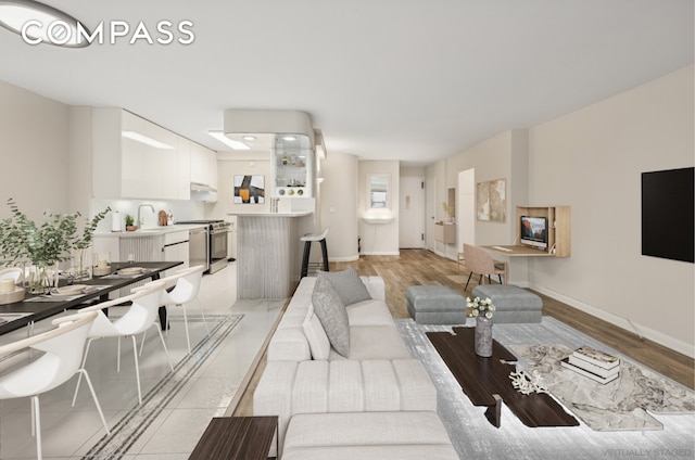211 E 53rd St Unit 7C, New York City, NY 10022 - living area featuring light wood-style floors