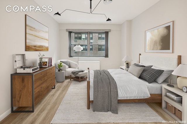211 E 53rd St Unit 7C, New York City, NY 10022 - bedroom with light wood finished floors and baseboards