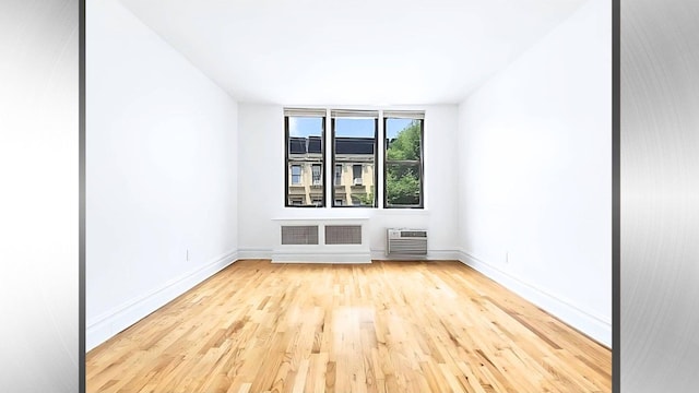 1628 2nd Ave Unit 2B, New York City, NY 10028 - empty room featuring wood finished floors and an AC wall unit