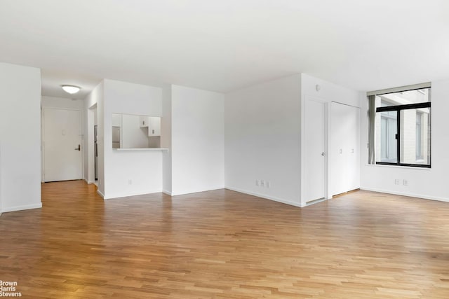 400 E 70th St Unit 503, New York City, NY 10021 - unfurnished room with light wood-style flooring and baseboards