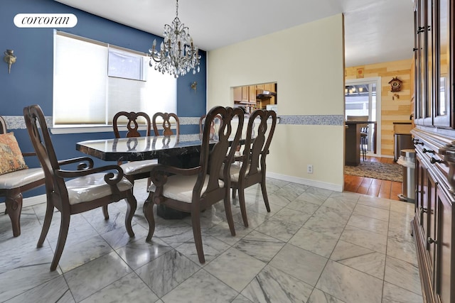 2054 Richmond Ave, New York City, NY 10314 - dining area featuring light marble finish flooring and a chandelier