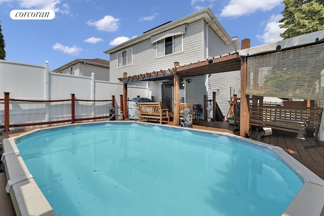 2054 Richmond Ave, New York City, NY 10314 - view of swimming pool with a wooden deck and a pergola
