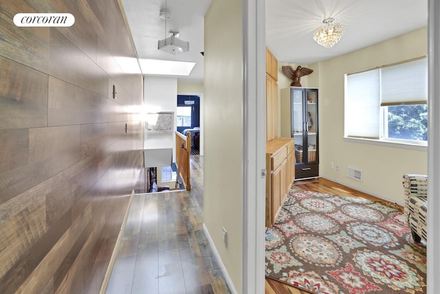 2054 Richmond Ave, New York City, NY 10314 - hallway with plenty of natural light, wood finished floors, a chandelier, and an upstairs landing