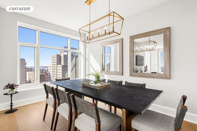 100 Claremont Ave Unit 17B, New York City, NY 10027 - dining space featuring a chandelier and wood finished floors