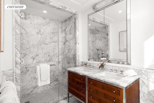 100 Claremont Ave Unit 17B, New York City, NY 10027 - full bathroom with a marble finish shower, double vanity, tile walls, and recessed lighting