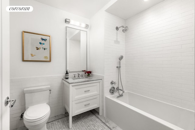 100 Claremont Ave Unit 17B, New York City, NY 10027 - bathroom featuring vanity, bathtub / shower combination, wainscoting, and tile walls