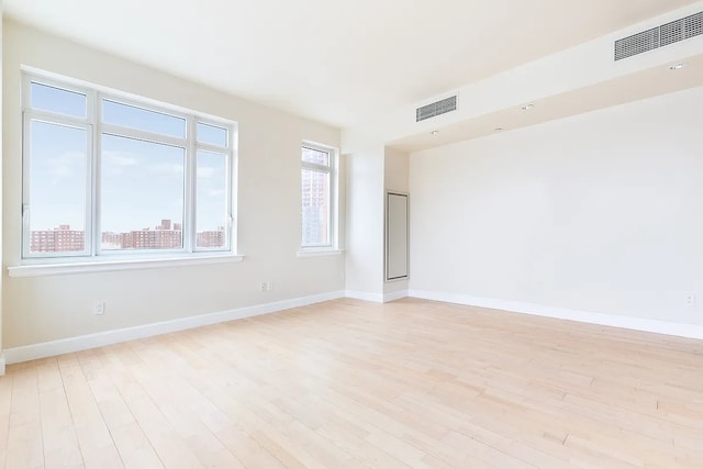 2300 Frederick Douglass Blvd Unit 11B, New York City, NY 10027 - spare room featuring light wood finished floors