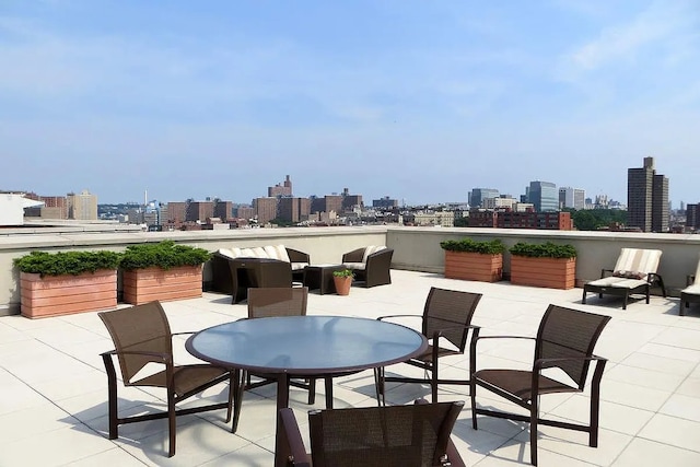 2300 Frederick Douglass Blvd Unit 11B, New York City, NY 10027 - view of patio with a skyline view and outdoor dining space
