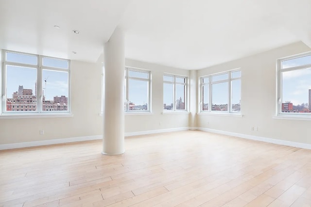2300 Frederick Douglass Blvd Unit 11B, New York City, NY 10027 - unfurnished living room with light wood-style floors and baseboards