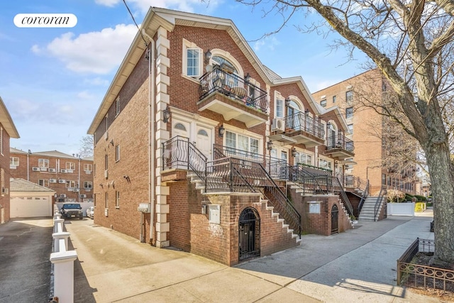 57 Bay 31st St Unit 3A, New York City, NY 11214 - view of apartment building / complex featuring stairs and concrete driveway