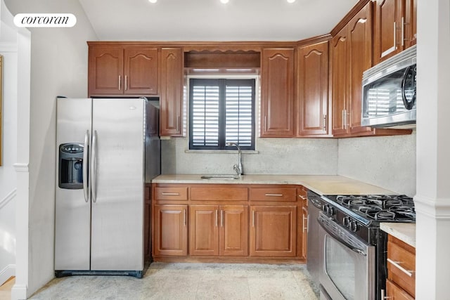 57 Bay 31st St Unit 3A, New York City, NY 11214 - kitchen featuring stainless steel appliances, light countertops, brown cabinets, decorative backsplash, and recessed lighting