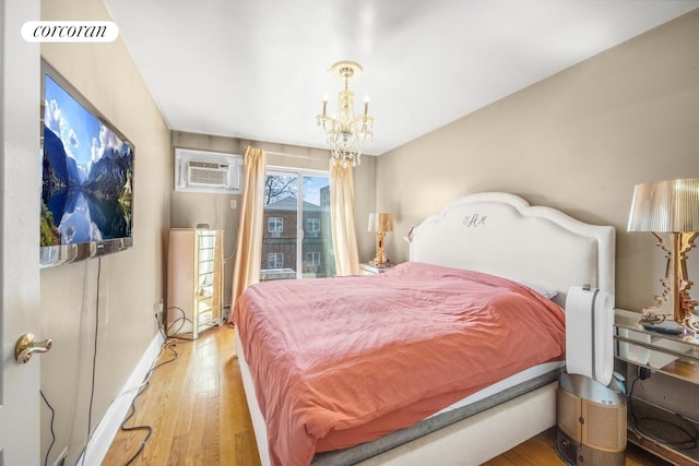 57 Bay 31st St Unit 3A, New York City, NY 11214 - bedroom with wood finished floors, a chandelier, and a wall unit AC