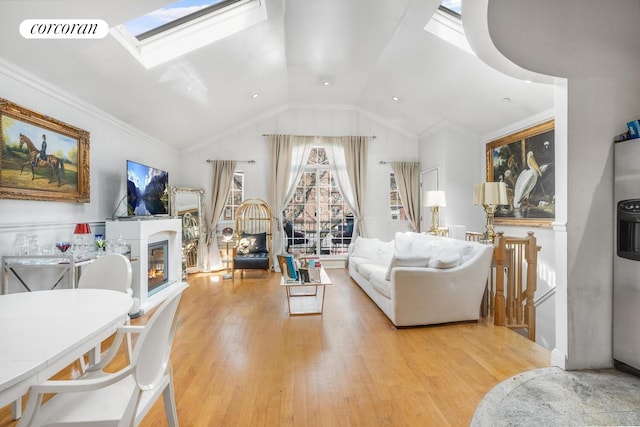 57 Bay 31st St Unit 3A, New York City, NY 11214 - living room with wood finished floors, lofted ceiling, a glass covered fireplace, and a skylight