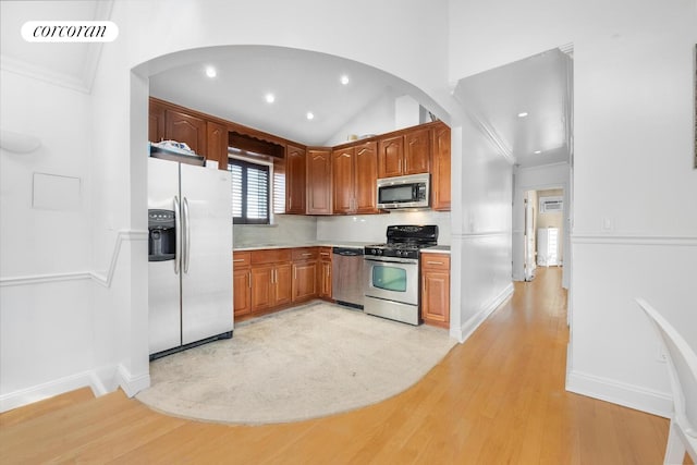 57 Bay 31st St Unit 3A, New York City, NY 11214 - kitchen with appliances with stainless steel finishes, arched walkways, light wood-style floors, recessed lighting, and light countertops