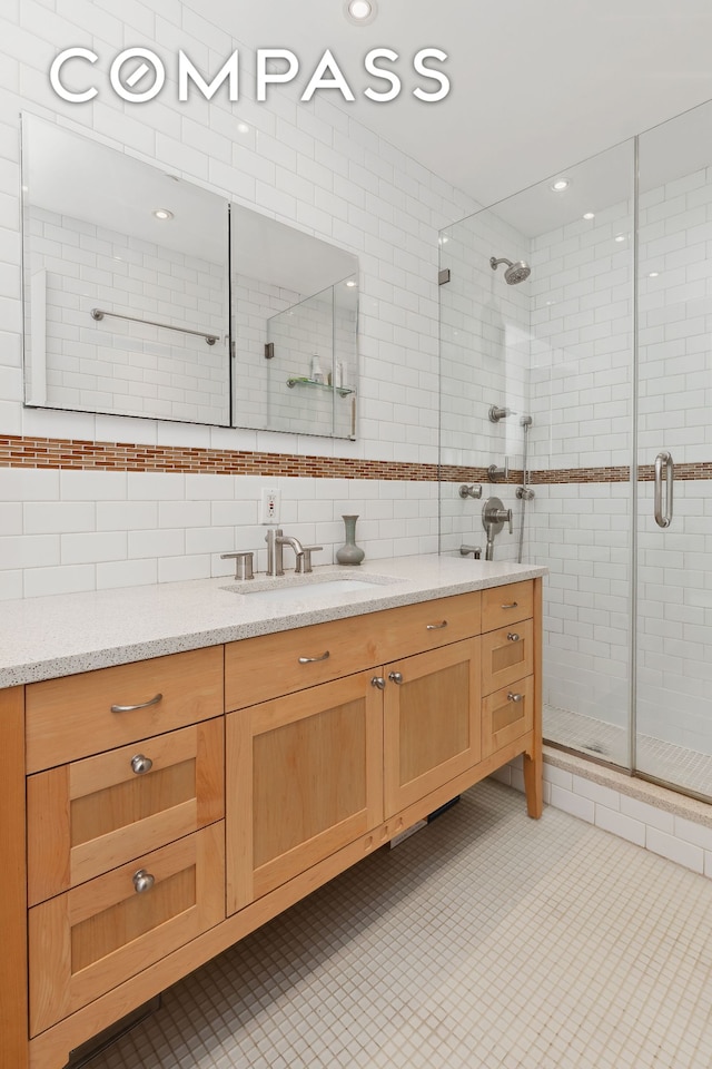 525 E 89th St Unit 4Hj, New York City, NY 10128 - full bathroom with vanity, a shower stall, and backsplash