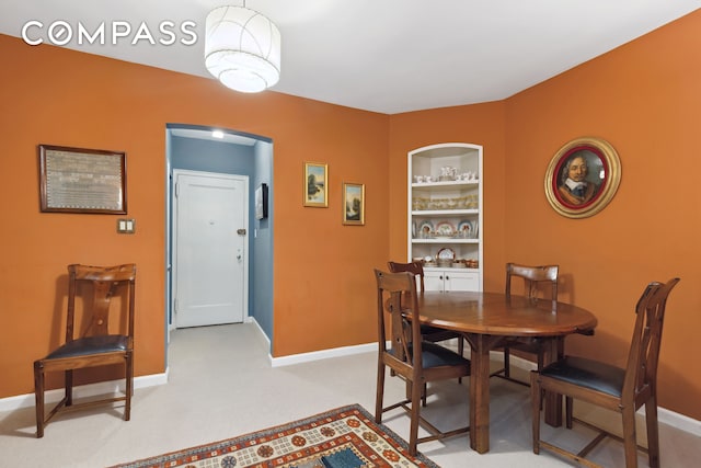 525 E 89th St Unit 4Hj, New York City, NY 10128 - dining area featuring baseboards and built in shelves