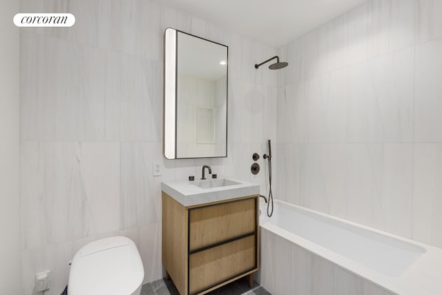 250 E 25th St Unit 9D, New York City, NY 10010 - bathroom with tile walls, vanity, and tiled shower / bath
