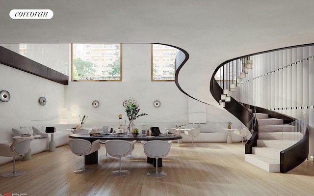 250 E 25th St Unit 9D, New York City, NY 10010 - entrance foyer with wood finished floors, plenty of natural light, stairs, and a high ceiling