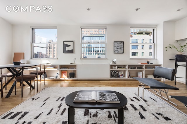 350 W 14th St Unit 6D, New York City, NY 10014 - living room with wood finished floors and a desk