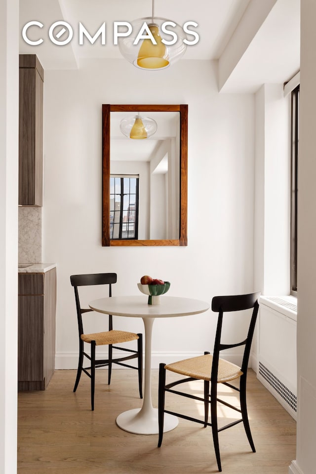 201 W 16th St Unit 9A, New York City, NY 10011 - dining area with light wood-style flooring