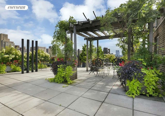 19 E 88th St Unit 4H, New York City, NY 10128 - view of patio featuring a pergola and a city view