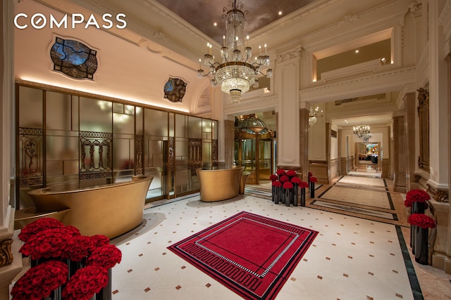 2 E 55th St Unit 1135W49, New York City, NY 10022 - common area with a decorative wall, ornamental molding, a high ceiling, and a wainscoted wall