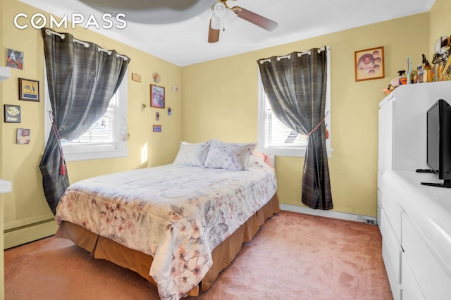 88-29 212th St, New York City, NY 11427 - bedroom featuring light carpet, a baseboard heating unit, and ceiling fan