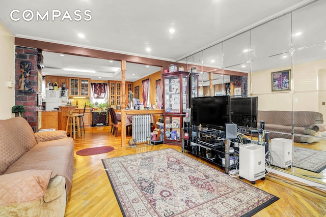 88-29 212th St, New York City, NY 11427 - living room with bar area, wood finished floors, and crown molding