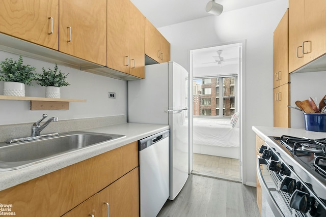 55 E End Ave Unit 15J, New York City, NY 10028 - kitchen featuring stainless steel appliances, a ceiling fan, open shelves, light countertops, and light wood finished floors