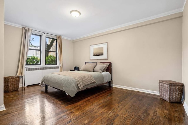 350 Cabrini Blvd Unit 1A, New York City, NY 10040 - bedroom with radiator heating unit, crown molding, and dark wood finished floors