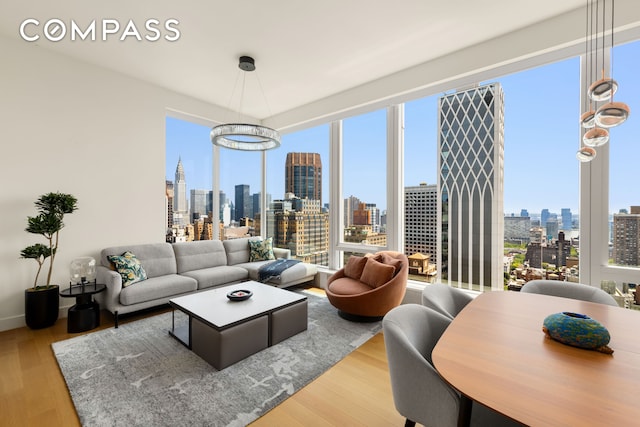 15 E 30th St Unit 30C, New York City, NY 10016 - living room with a view of skyline and healthy amount of natural light