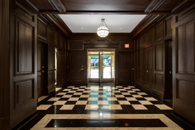 10 Park Ave Unit 1/2H, New York City, NY 10016 - entrance foyer featuring a decorative wall, crown molding, and inlaid floor details