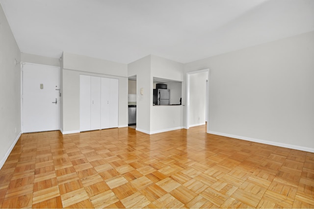 400 E 70th St Unit 1208, New York City, NY 10021 - unfurnished living room featuring baseboards